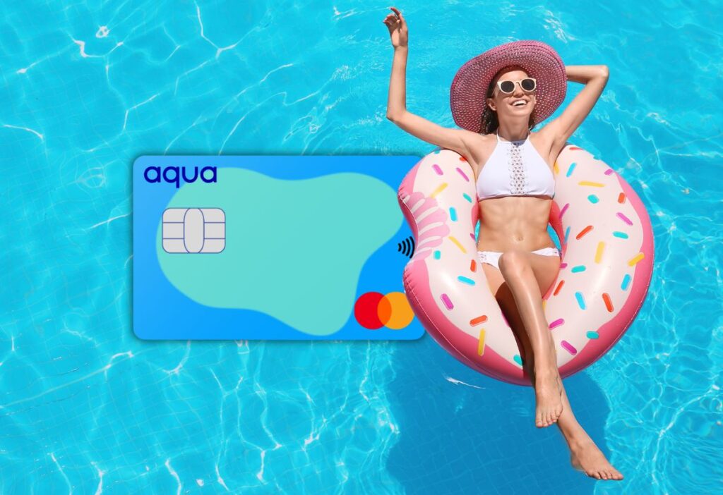 Aqua Classic Credit Card floating in a pool alongside a woman relaxing on a doughnut-shaped inflatable, symbolising financial freedom and relaxation.