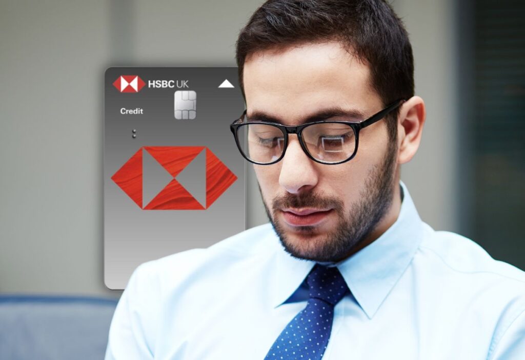 A man in business attire and glasses looking focused, with the HSBC Balance Transfer Credit Card graphic in the background.