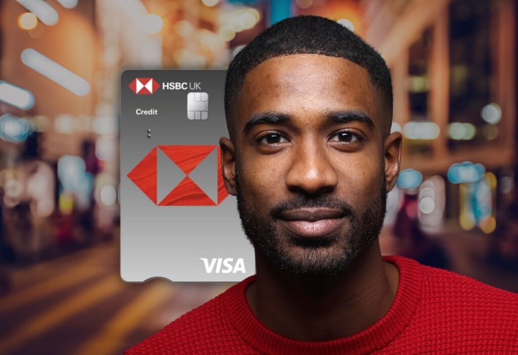 Man with a beard smiling, with the HSBC Classic Credit Card in the background, featuring the HSBC logo and Visa branding.