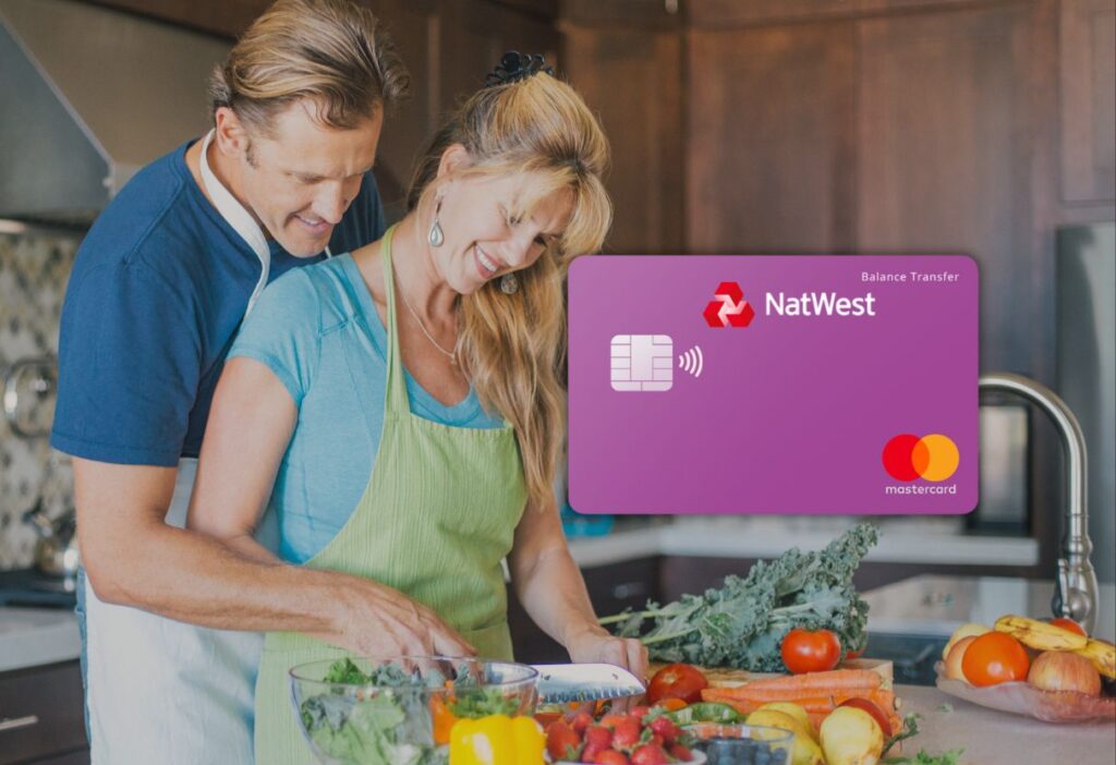 Happy couple cooking together in a warm kitchen with a purple NatWest balance transfer credit card overlay, representing financial security and shared life moments.