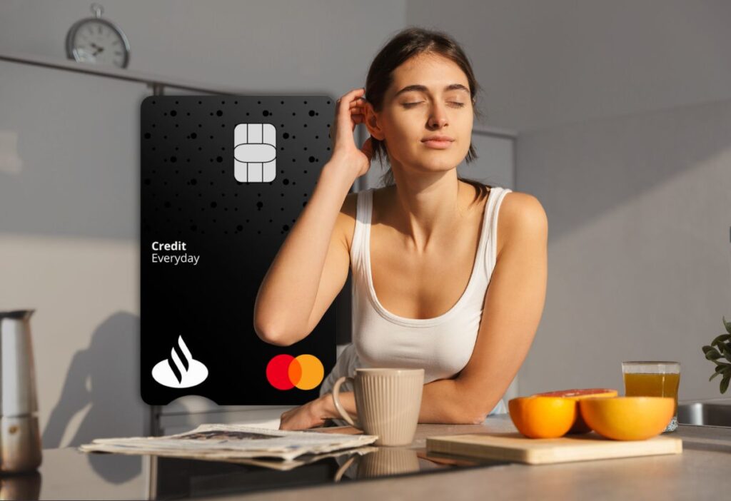 Woman enjoying a relaxed morning with a Santander Everyday Long Term Balance Transfer Credit Card in the background, symbolising financial ease and smart money management.