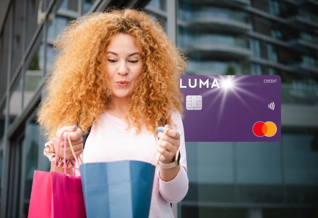 Smiling woman holding shopping bags with a purple Luma credit card overlay, representing financial convenience and shopping enjoyment.